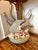 This is an ocean-themed decorative floral centerpiece featuring a stone-style fish figurine surrounded by various...