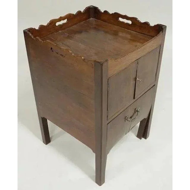 Antique 18th c. Georgian mahogany cabinet with shaped gallery tray above a cabinet enclosed by two doors and a pull out...