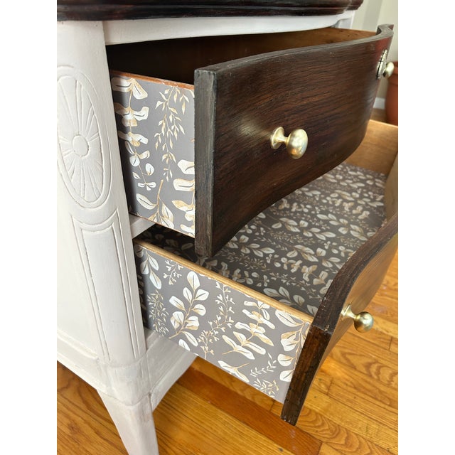 This little serpentine two drawer dresser is stout and she's sturdy! She has new brushed gold knobs and her framing below...