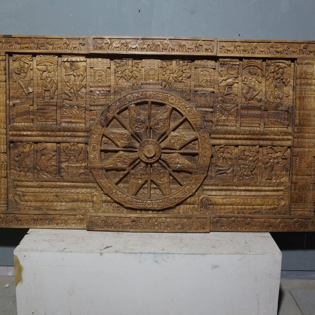 Celebrate the artistry of India's architectural heritage with this large hand-carved wooden Konark Chariot Wheel panel,...
