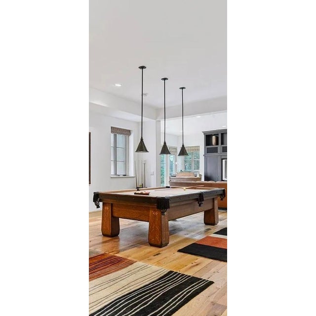 An extraordinary, architectural-grade collection of 3 matching, custom-commissioned pendant lights handcrafted by renowned...