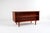 Elegant Danish mid-century desk crafted in teak, featuring clean lines and practical design. The front offers four...