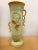 Austrian hand-glazed, tall vase with asymmetrical decorative handles, features abstract floral painted design