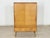 Beautiful vintage cabinet from the 1960s. This piece of furniture impresses with its typical mid-century design, the warm...