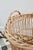 A French wicker bakery basket, once used to store and display baguettes, with a tall, slender shape and a beautiful...