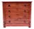 American pine chest of four Knapp dovetail drawers with original locks and working key in the cottage style boasting the...