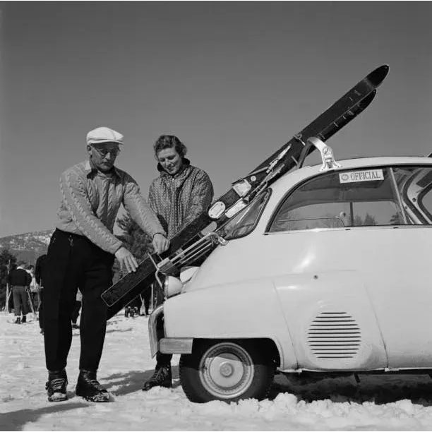 New England Skiing Essentials 1955 A couple prepare for a day’s skiing in New Hampshire, 1955. Slim Aarons Slim Aarons was...