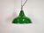 Industrial green enamel factory pendant light made in United Kingdom during the 1960s. White enamel inside the shade. Iron...