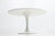 Round tulip dining table designed by Eero Saarinen for Knoll International during the late 1950s. Materials: White...