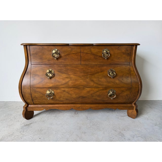 Beautiful vintage Baker furniture Louis XV style Bombay chest, showcasing elegant curves and a rich wood throughout. This...