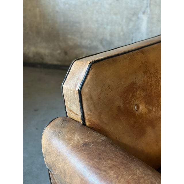 Super comfortable! A late art deco sofa by Bart Van Bekhoven. Original upholstered with brown sheep’s leather, outlined...