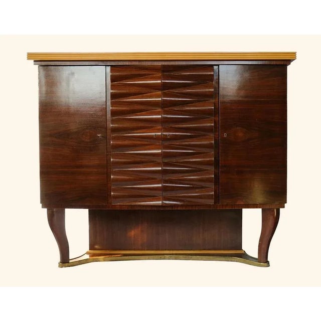Large Italian mahogany Art Deco bar cabinet designed by Michele Merighi and made by Ronconi Cantù. This cabinet is part of...