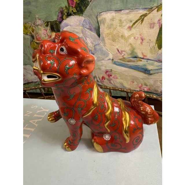 A striking Herend porcelain red foo dog (guardian lion) in the coveted Herend Asian Collection Red Dynasty Godollo...