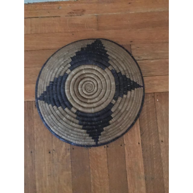 Beautiful round hand-made African woven basket blue and brown. Decorative and functional. Good condition. Acquired at an...