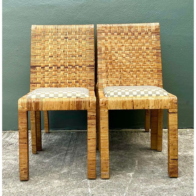 This exceptional set of four vintage dining chairs beautifully captures the essence of Coastal Modern and Boho Chic...