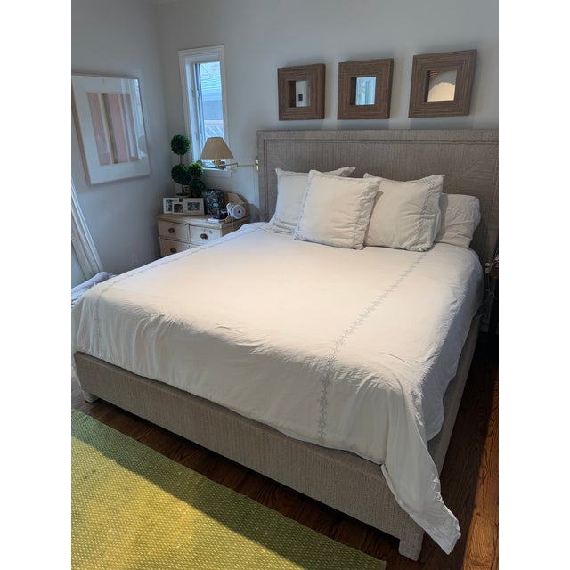 Barely used bed frame from Palecek, in perfect condition. Plantation hardwood frame, rails and legs hand-wrapped with...