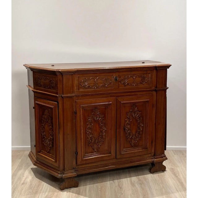 Northern Italian walnut buffet-credenza, probably from the Piedmont area. Rare trapezoidal shape with side doors....