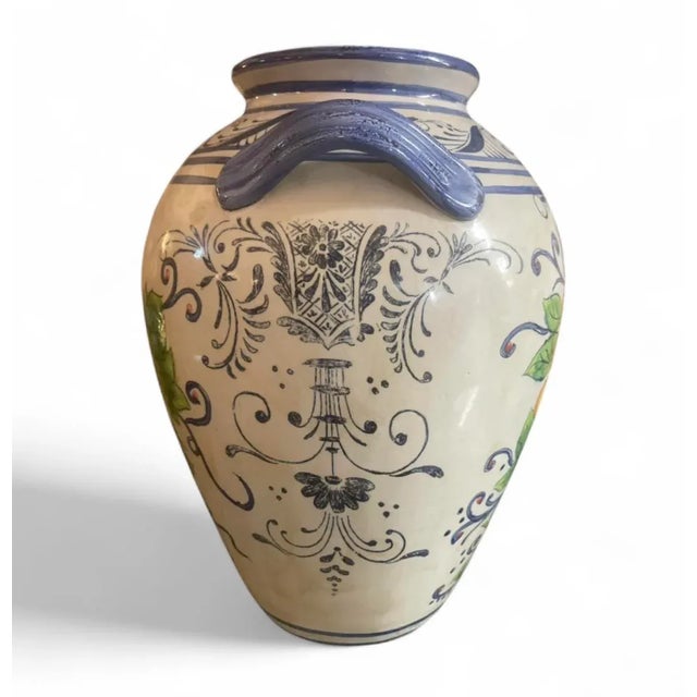 This substantial and eye-catching ceramic double-handled vase (often referred to as an amphora or jar) is a beautiful...