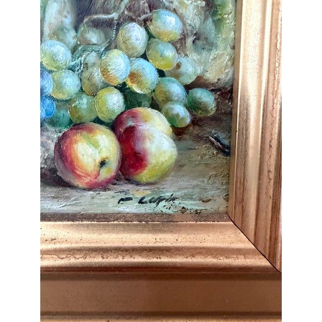 Petite vintage fruit still life, oil on board, featuring clusters of purple and green grapes, apples, and a green vessel...