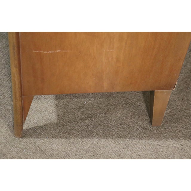This American made side table is a great example of 1960s style and design. Warm walnut grain table with open storage and...