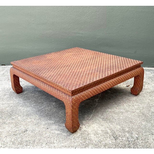 This monumental square coffee table by Baker Furniture is an exquisite marriage of traditional Ming Dynasty silhouettes...