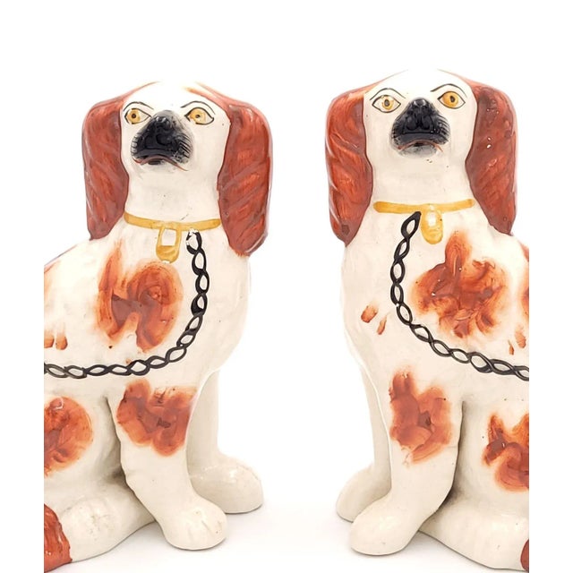 A pair of English Staffordshire spaniels, circa 1880.