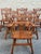 Cushman-style dining set, 7 pieces, mid 20th century. Solid wood construction with warm medium-tone finish. Dining table...