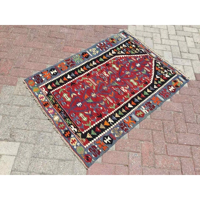 This beautiful, vintage, handwoven kilim is approximately 60 years old. It is handmade of very fine quality, hand-spun...