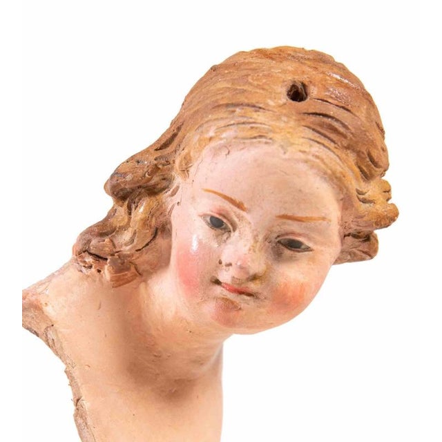Head of young girl realized in polychrome ceramic with glass eyes. Neaples, 18th Century. Very good condition.