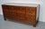 This beech haberdashery shop counter dates from the 1920-1930s and was made in England. It features a solid wooden frame,...