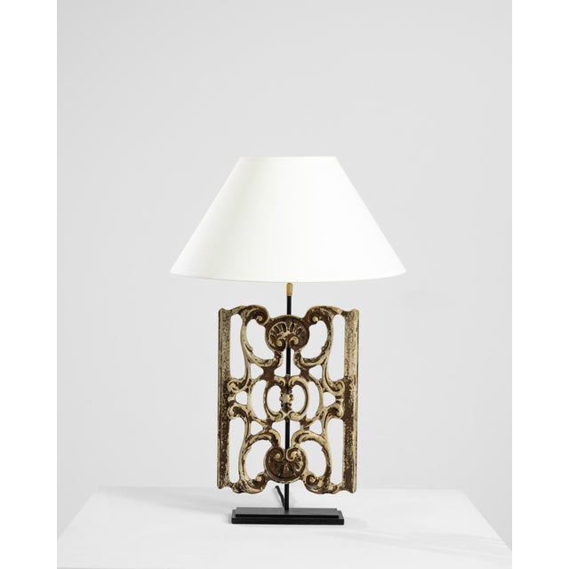 Made from a piece of reclaimed wooden ornament, this table lamp makes a truly unique accent. The base was originally...