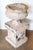 A pair of English Edwardian period reconstituted stone urns on pedestals from the early 20th century, with lion heads and...