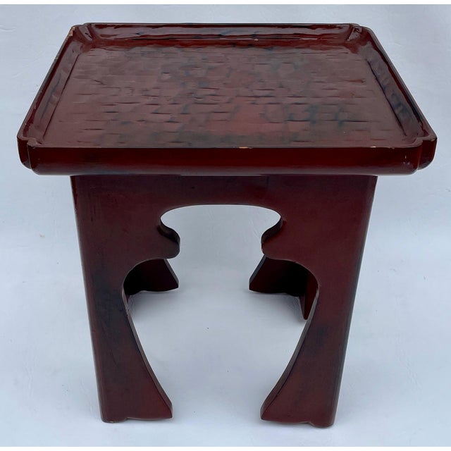 It is rustically hand-carved throughout, with a basket texture on the top. The curvy legs have an urn-shaped cutout. It is...