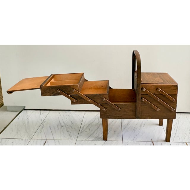 This well maintained accordion style sewing box was manufactured in Norway by Strommen Bruk Hamar. The ingenious design...