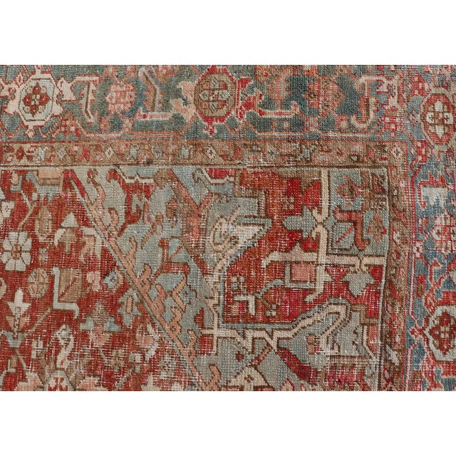 Textile Early 20th Century Antique Heriz Rug With All-Over Medallion Design in Red, Blue, Pink, Tan & Brown For Sale - Image 7 of 13