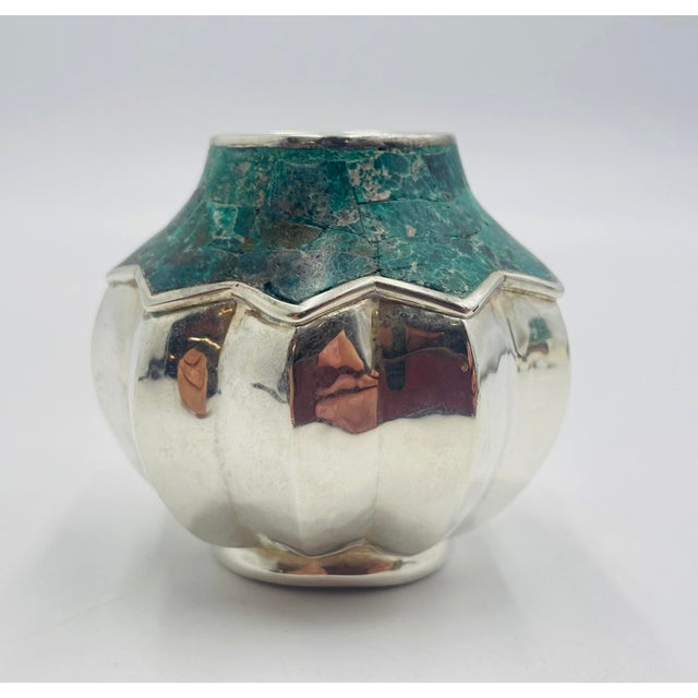 A striking Mexican Modernism decorative vase designed and handcrafted in Taxco, Mexico by renowned silversmith Emilia...