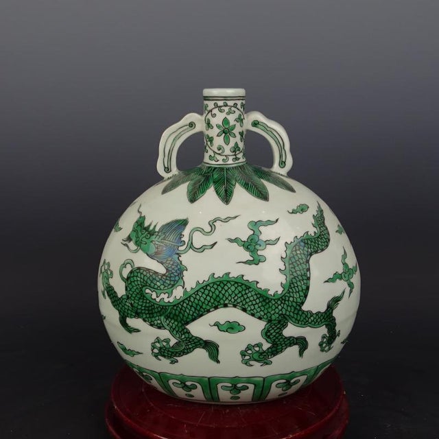 W-24cm,H-26.5cm The Xuande Marked Green Color Porcelain Moonflask Vase with a hand-painted dragon pattern is a stunning...
