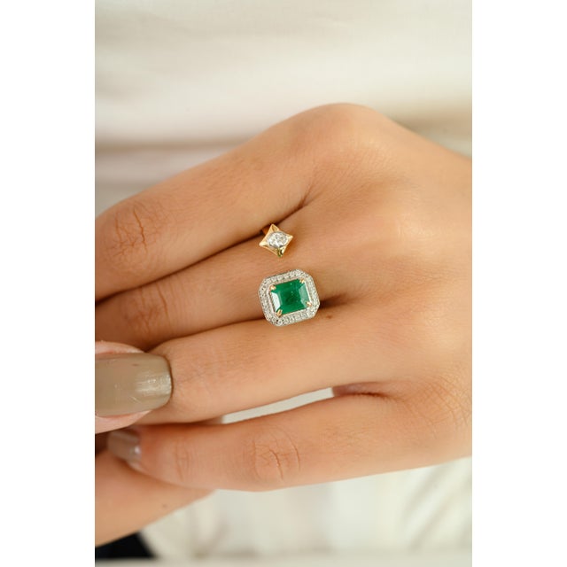 Elevate your jewelry collection with this striking asymmetrical bypass ring, expertly crafted in 18k yellow gold. At the...