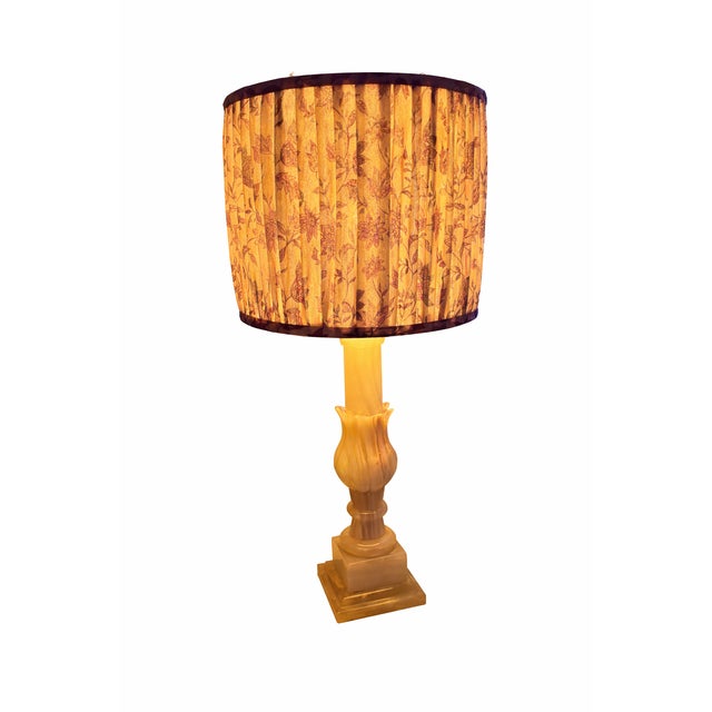 This vintage Italian table lamp is crafted from solid onyx stone, showcasing soft translucent veining and a timeless...