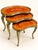 Exceptionally beautiful set of three interlocking side tables in an elegant kidney shape. The legs are richly decorated...