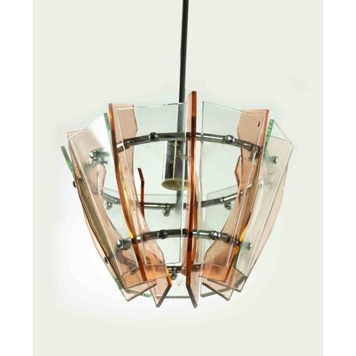 Pink and Green Chandelier is an original design lamp realized by Anonymous designer in the 1970s. A vintage lamp realized...