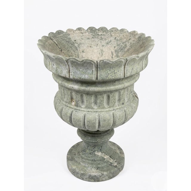 Elevate your garden or interior space with this striking Neoclassical-style urn planter, masterfully carved from a unique...