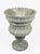 Elevate your garden or interior space with this striking Neoclassical-style urn planter, masterfully carved from a unique...