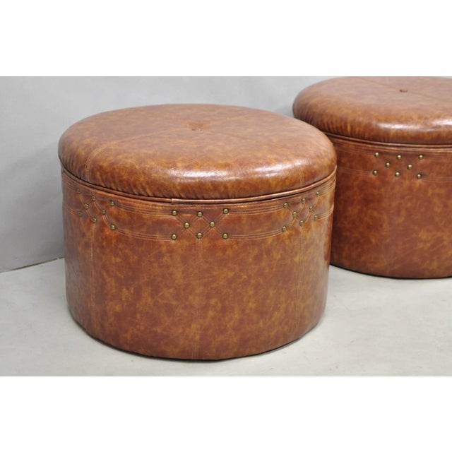 Contemporary Modern Moroccan Style Brown Faux Leather Round Storage Ottoman with Decorative Nail heads - a Pair. Circa...