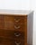 A tall Danish walnut chest of drawers in the Wanscher style, produced in the 1950s. Six graduated drawers run from deep at...
