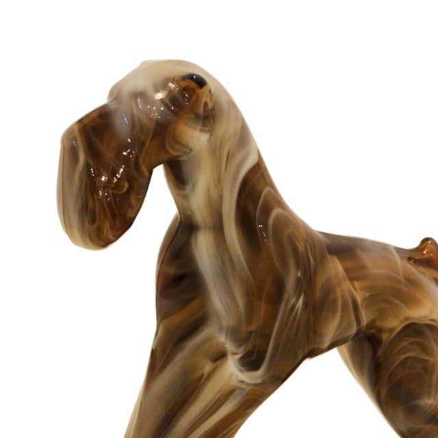 An exceptional and rare mid-century American slag glass figural study of an Airedale Terrier, circa 1940s–1950s. Standing...