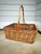 A beautifully oversized vintage handwoven willow gathering basket with an exceptionally large arched handle and...