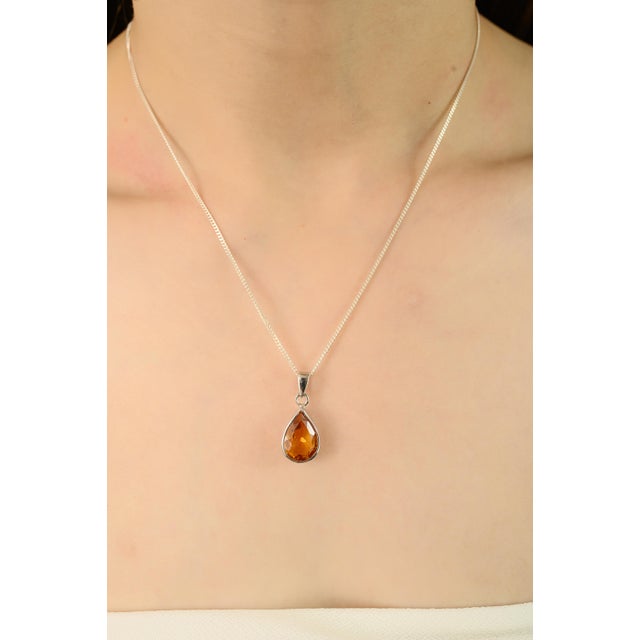 This Solitaire Citrine pendant is a lovely piece of handmade jewelry made using high-quality materials, designed to bring...