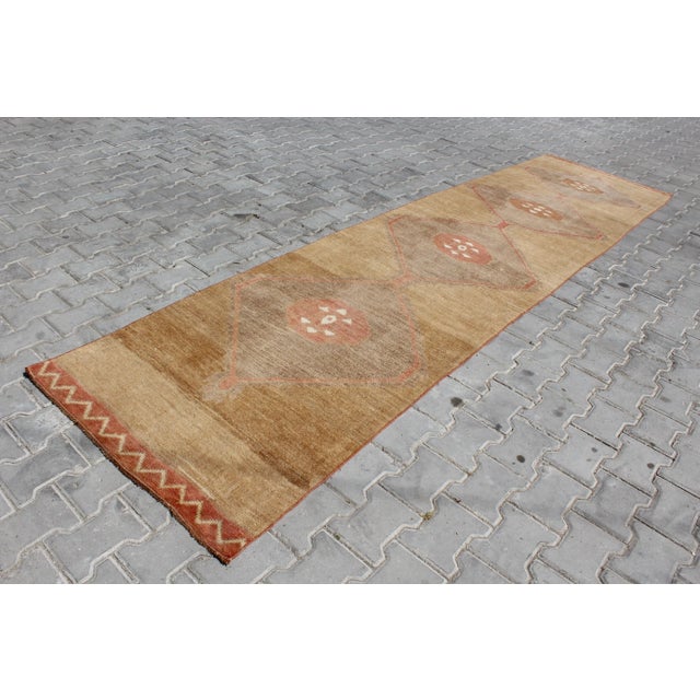 This beautiful, traditional vintage, hand knotted Turkish runner is approximately 60 years old. It is handmade of very...
