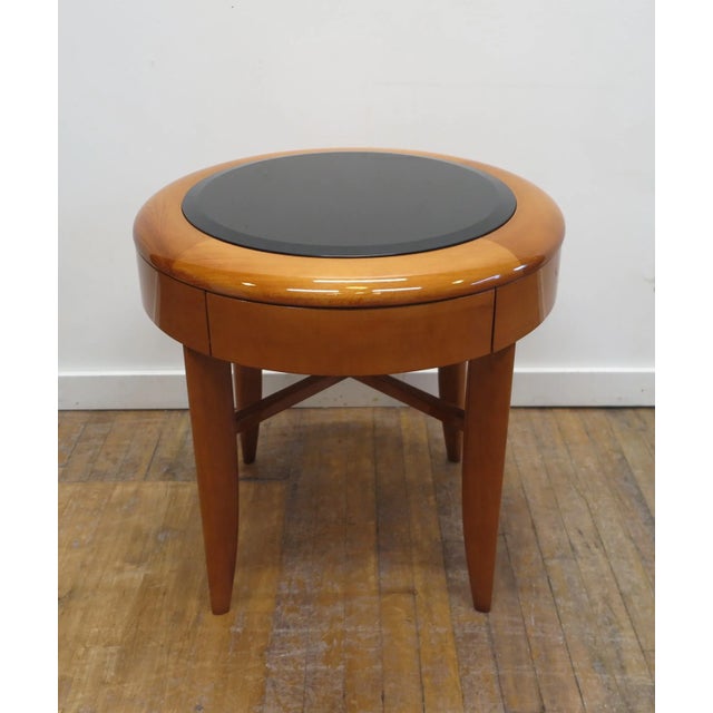 Pace round side table in Cherry with X base and inset beveled glass top by Adam Tihany for The Pace Collection. Having one...